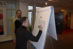 Wilhelm Wolf (links) und Jürgen Hotz (rechts) an der "Staffelei"